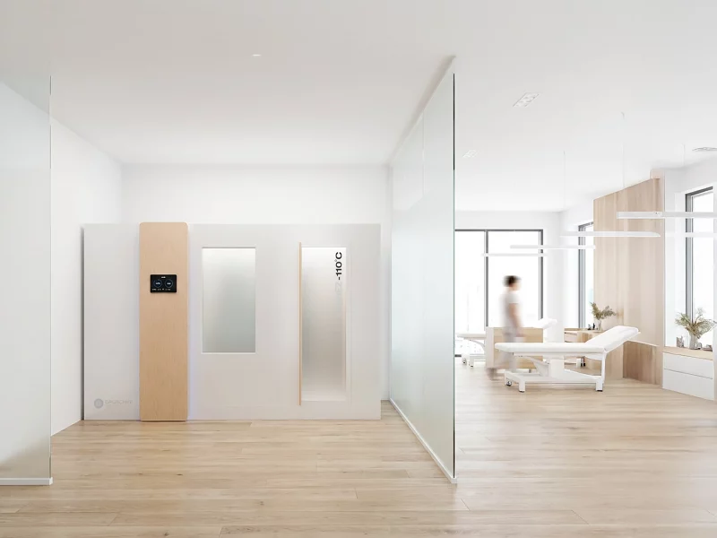 Kryokammer E"-110 Grad steht in einem separaten Raum einer Physiotherapiepraxis abgetrennt durch Glaswände